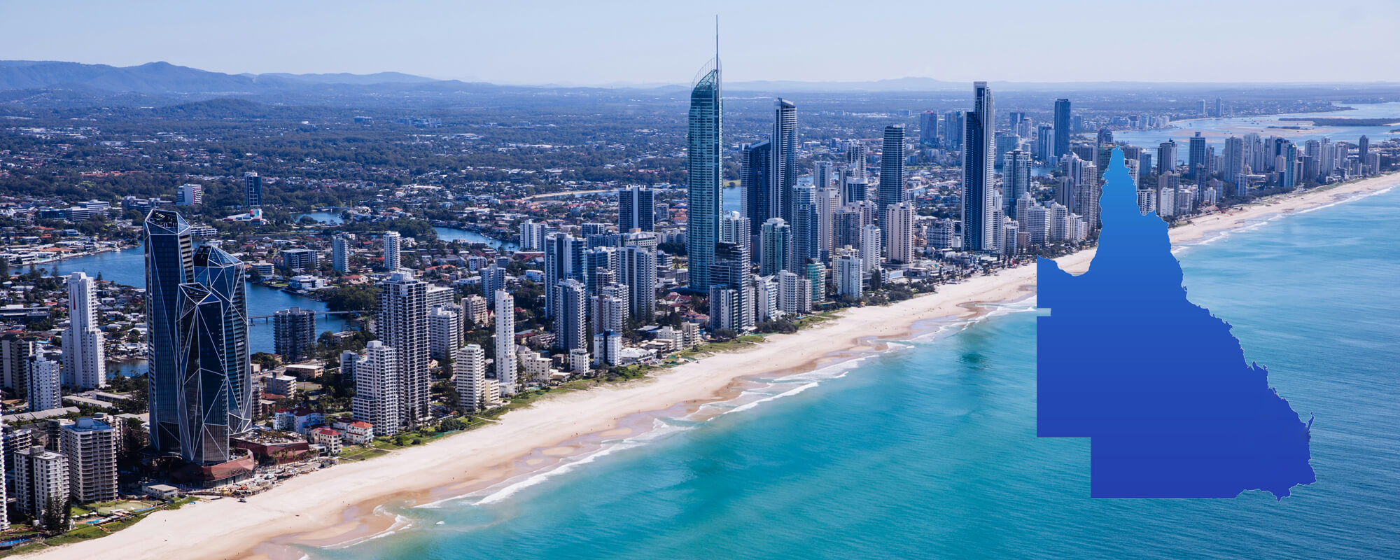 Aerial view of the Queensland coastline with the state outline